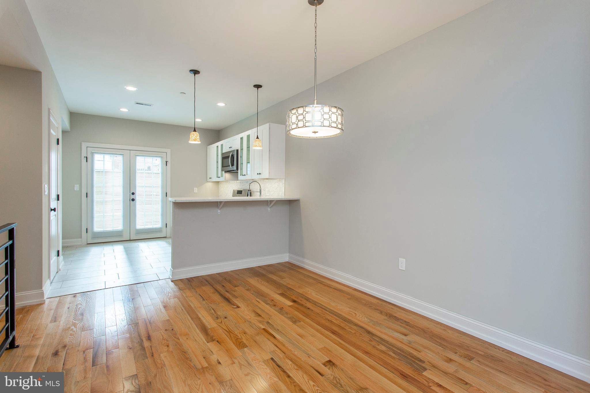 2052 Gerritt Street Philadelphia, PA 19146 - Photo 7 of 32 a view of a kitchen with wooden floor and a sink