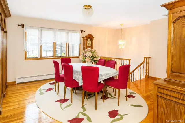 a view of a dining room with furniture window and wooden floor