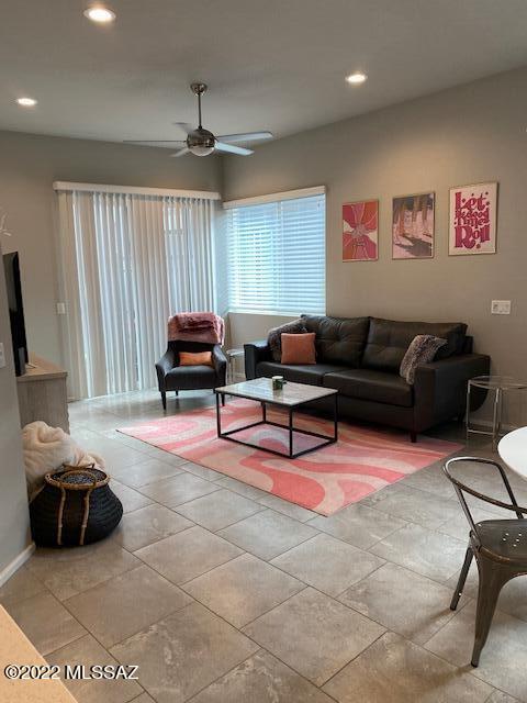 866 East Millenium Court Tucson, AZ 85719 - Photo 2 of 15 a living room with furniture and a flat screen tv