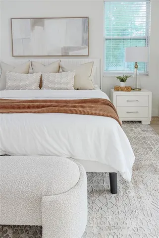 a bathroom with a bathtub and a window