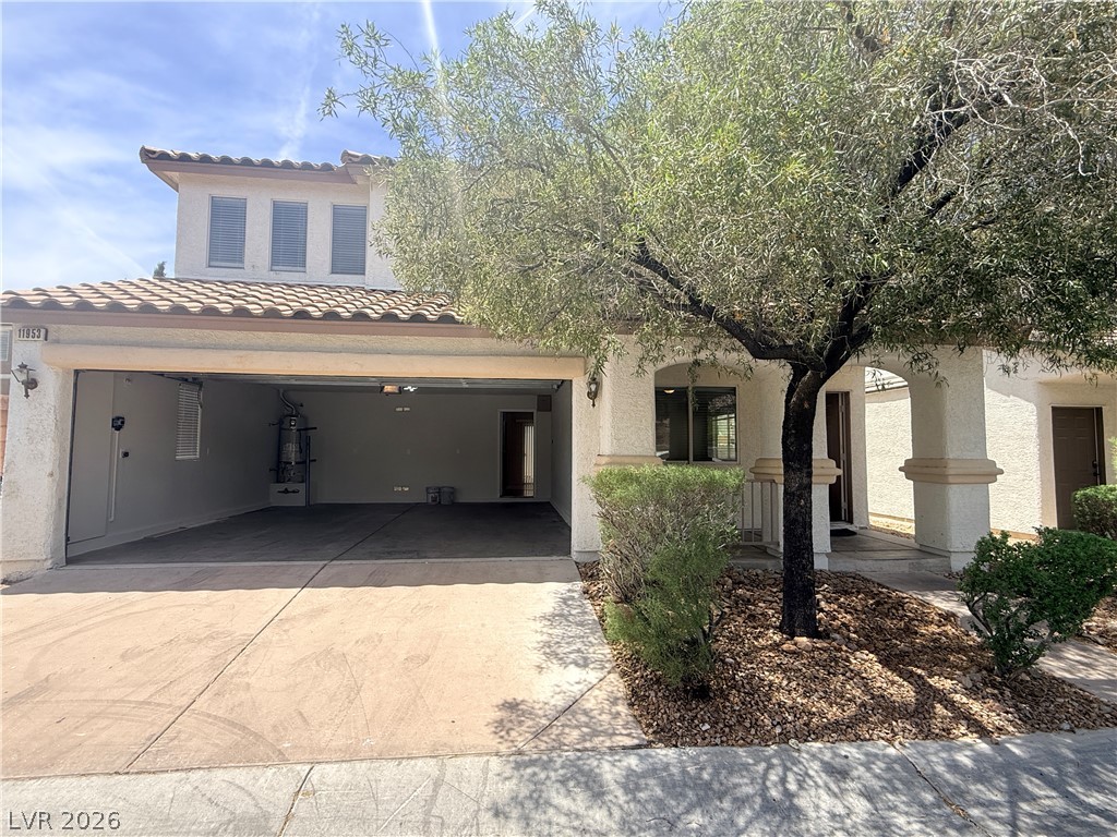 11953 Fairfax Ridge Street Las Vegas, NV 89183 - Photo 32 of 32 A terracotta tile roof crowns this home with an attached garage and a welcoming front entrance.