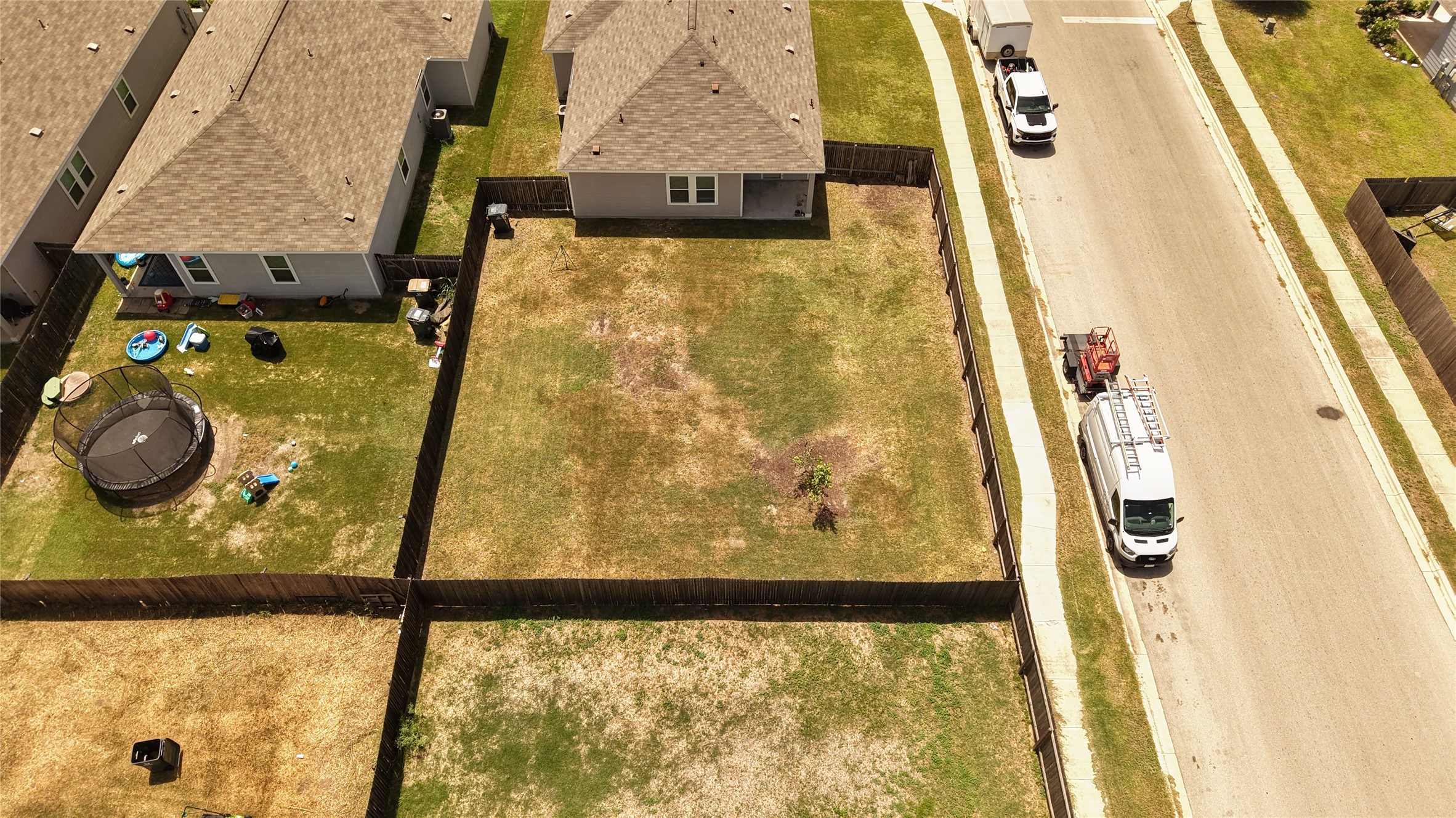 250 Seneca Loop Kyle, TX 78640 - Photo 20 of 22 A spacious backyard awaits, ready for your personal touch and creative landscaping vision.