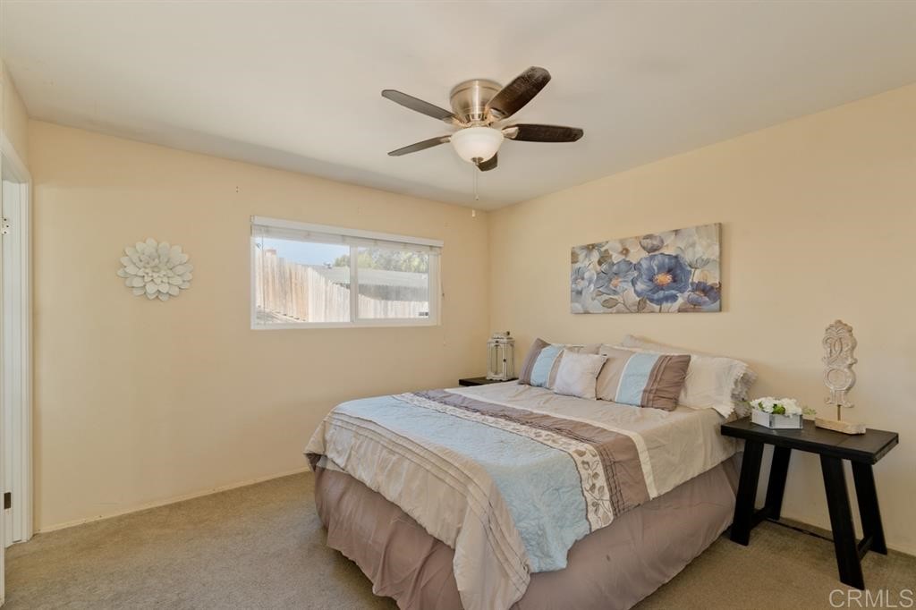 9456 Cathywood Drive Santee, CA 92071 - Photo 11 of 25 a bedroom with a bed and a painting on the wall