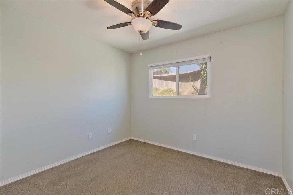 9456 Cathywood Drive Santee, CA 92071 - Photo 14 of 25 an empty room with a window and a fan