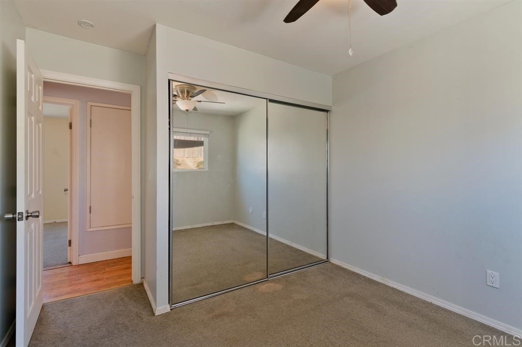 9456 Cathywood Drive Santee, CA 92071 - Photo 15 of 25 an empty room that has a glass door and shower