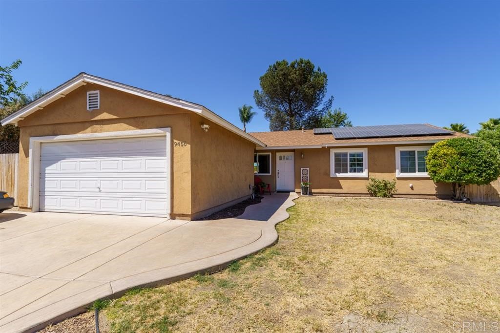9456 Cathywood Drive Santee, CA 92071 - Photo 24 of 25 a front view of a house with a yard and garage