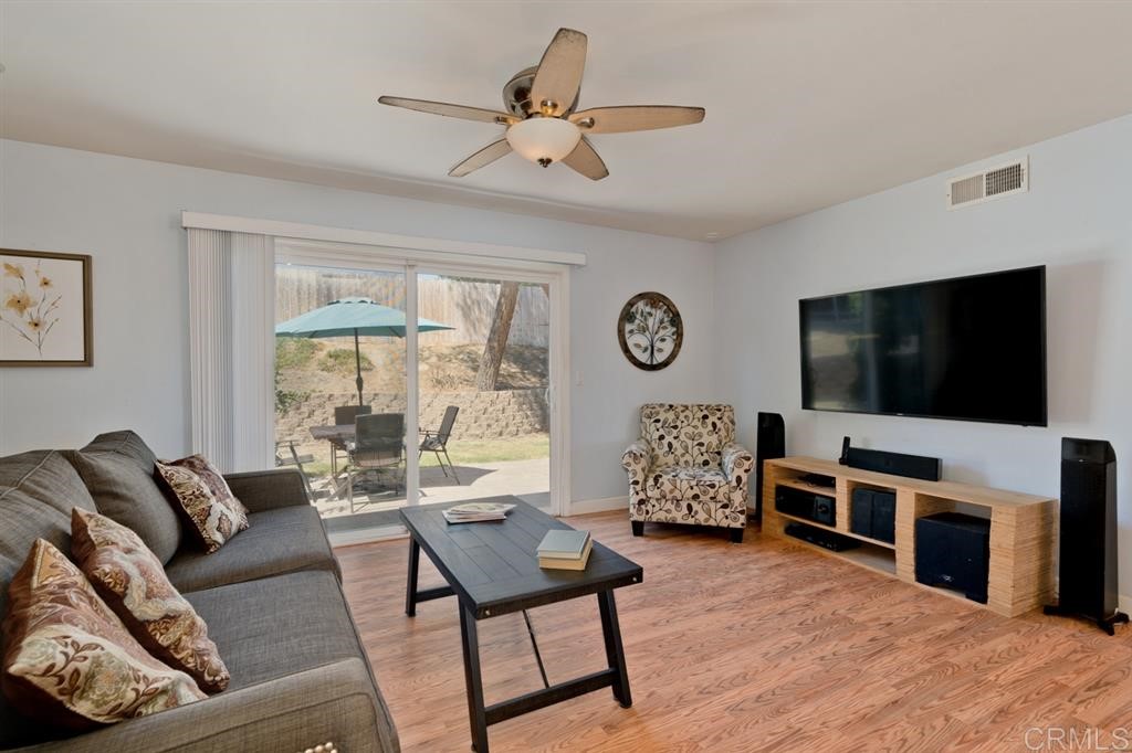 9456 Cathywood Drive Santee, CA 92071 - Photo 3 of 25 a living room with furniture and a flat screen tv