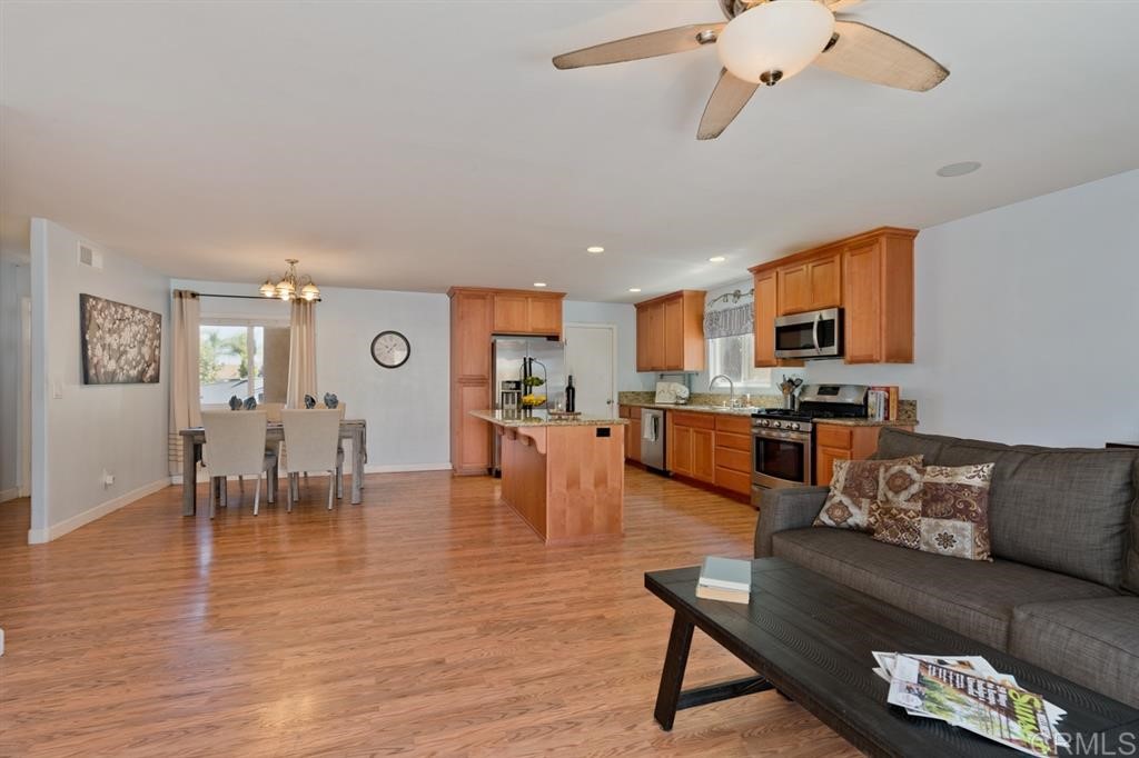 9456 Cathywood Drive Santee, CA 92071 - Photo 5 of 25 a living room with furniture kitchen view and a dining table