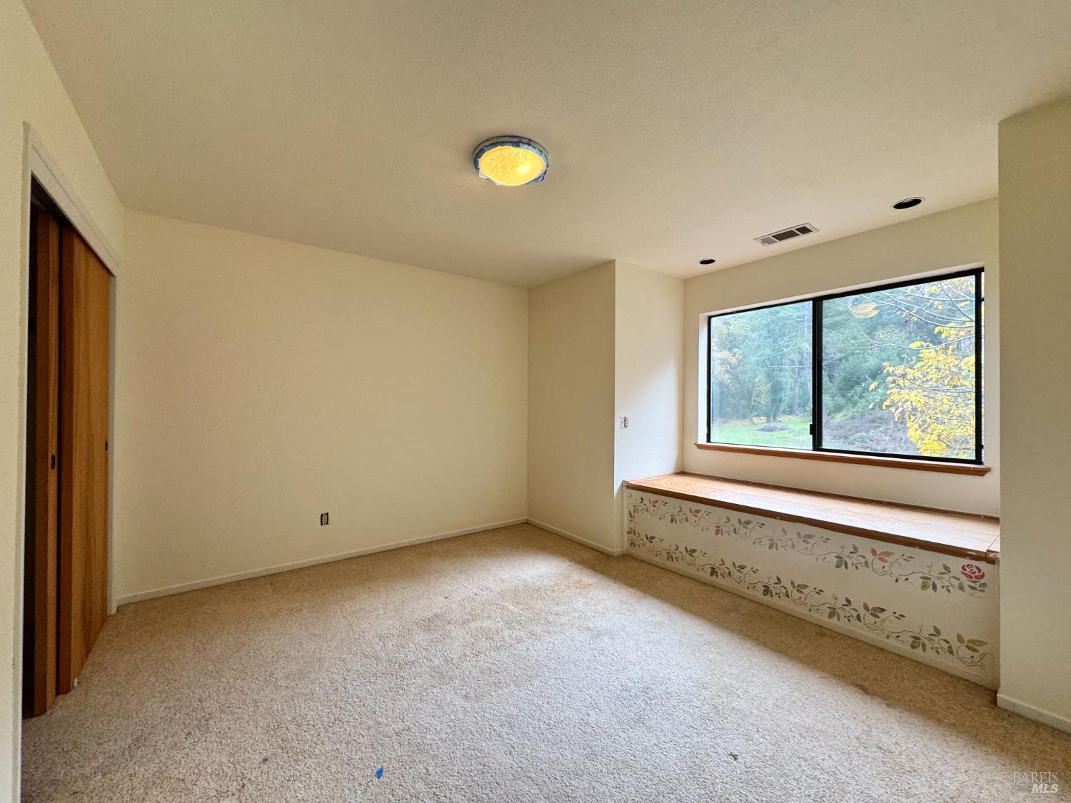 5083 Dry Creek Road Napa, CA 94558 - Photo 19 of 90 a view of an empty room with a window