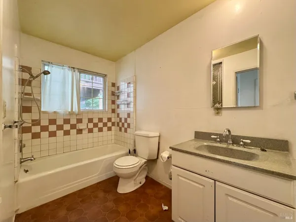 a view of a hallway with a chandelier fan and a chandelier