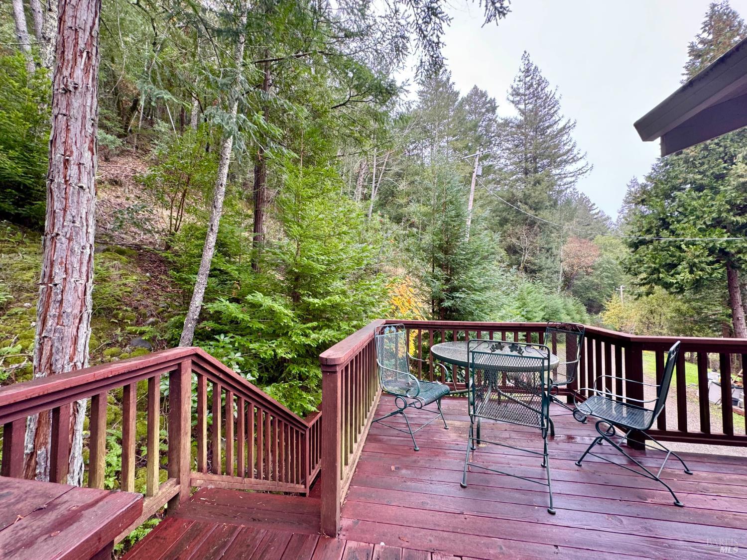 5083 Dry Creek Road Napa, CA 94558 - Photo 64 of 90 a view of a wooden deck with furniture