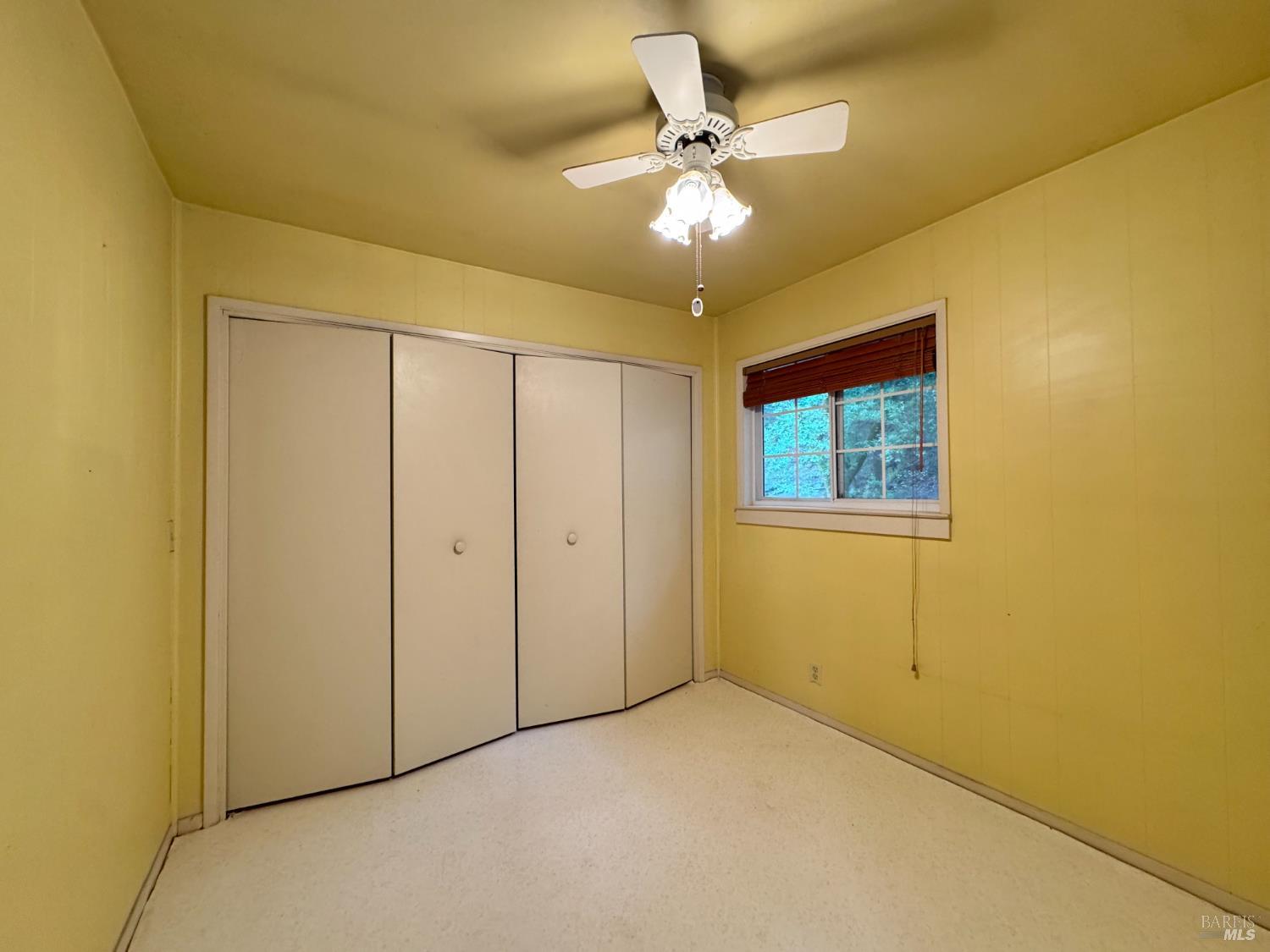 5083 Dry Creek Road Napa, CA 94558 - Photo 74 of 90 a view of an empty room with a chandelier fan