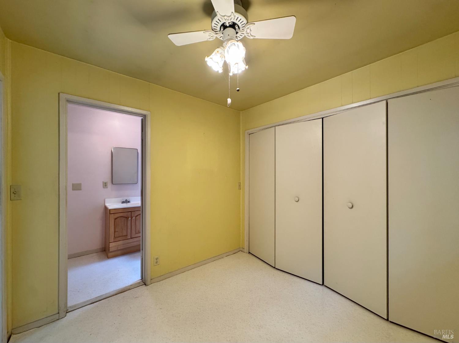 5083 Dry Creek Road Napa, CA 94558 - Photo 75 of 90 a view of a hallway with a chandelier fan and a chandelier