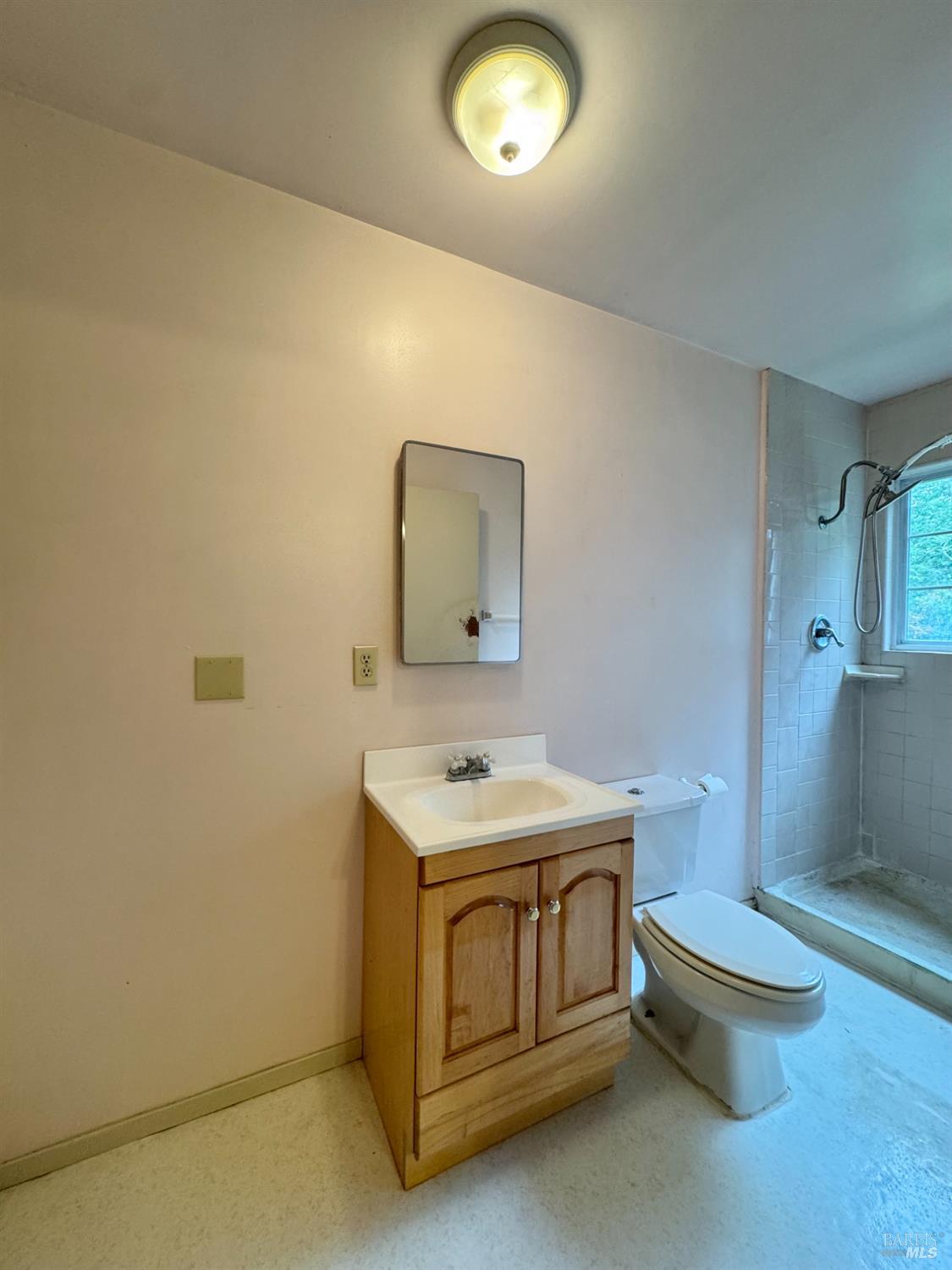 5083 Dry Creek Road Napa, CA 94558 - Photo 76 of 90 a bathroom with a sink toilet and mirror