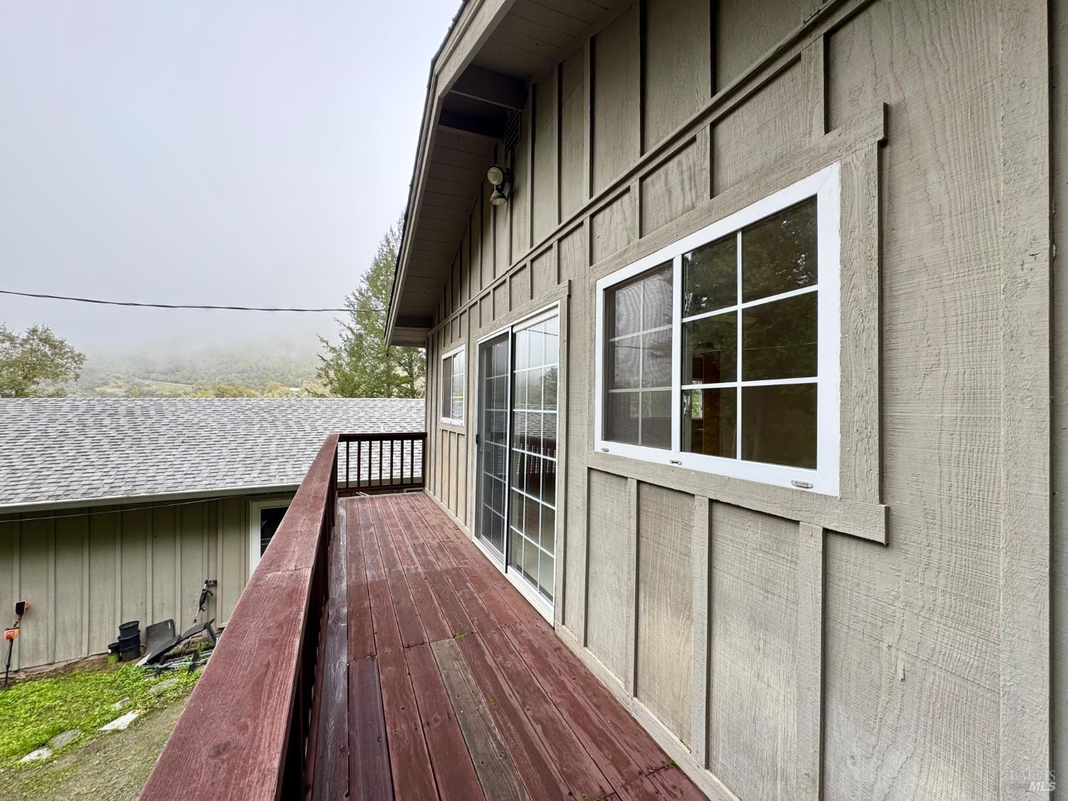 5083 Dry Creek Road Napa, CA 94558 - Photo 79 of 90 a view of balcony with wooden floor and fence