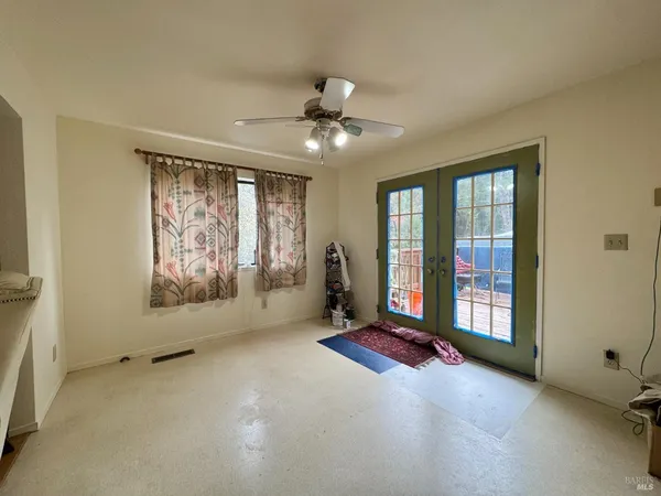 a kitchen with stainless steel appliances kitchen island granite countertop a refrigerator and a stove top oven
