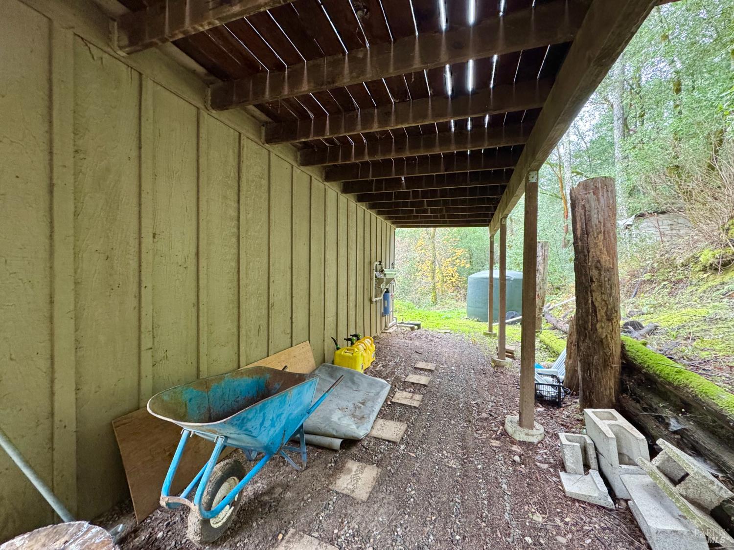 5083 Dry Creek Road Napa, CA 94558 - Photo 81 of 90 a wooden bench sitting in front of a building