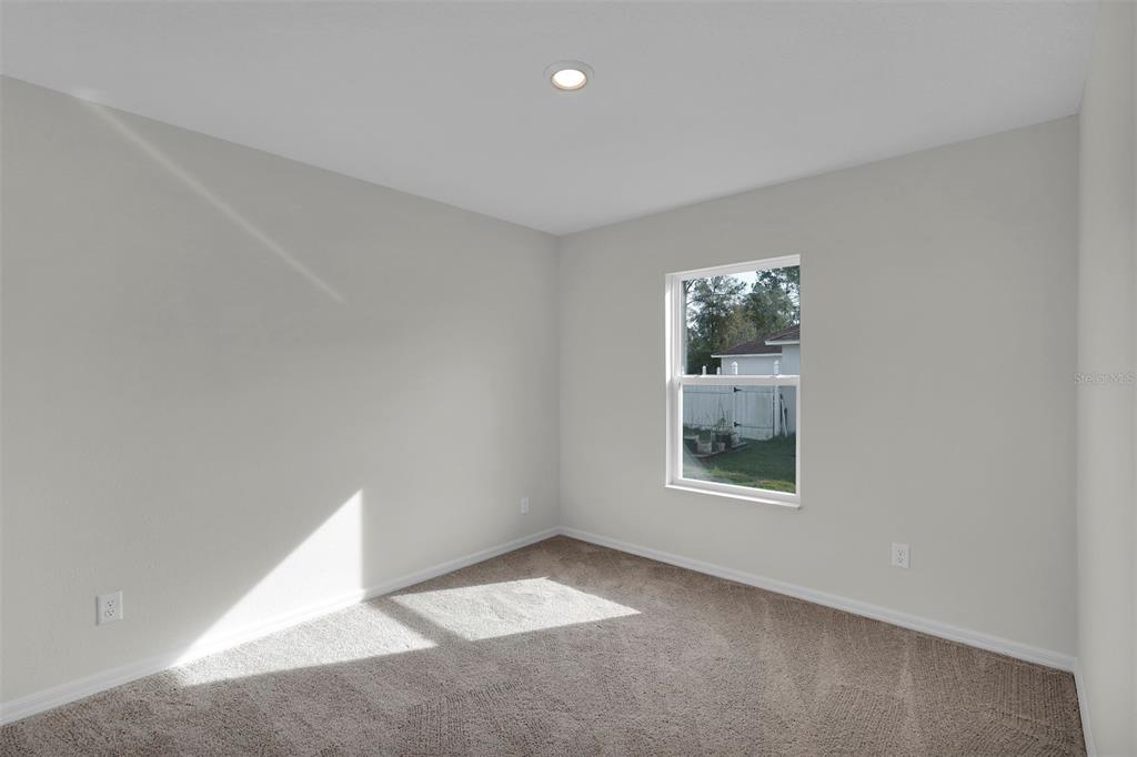 2 Prince Eric Lane Palm Coast, FL 32164 - Photo 16 of 20 an empty room with windows and closet