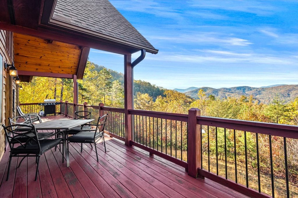 190 Regency Drive Murphy, NC 28906 - Photo 15 of 42 a view of a balcony with chairs and wooden floor