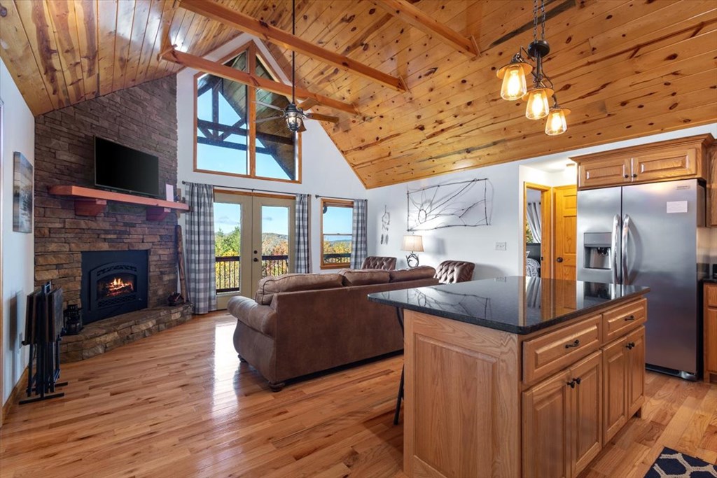 190 Regency Drive Murphy, NC 28906 - Photo 19 of 42 a kitchen with stainless steel appliances granite countertop a sink and a stove next to a larger window