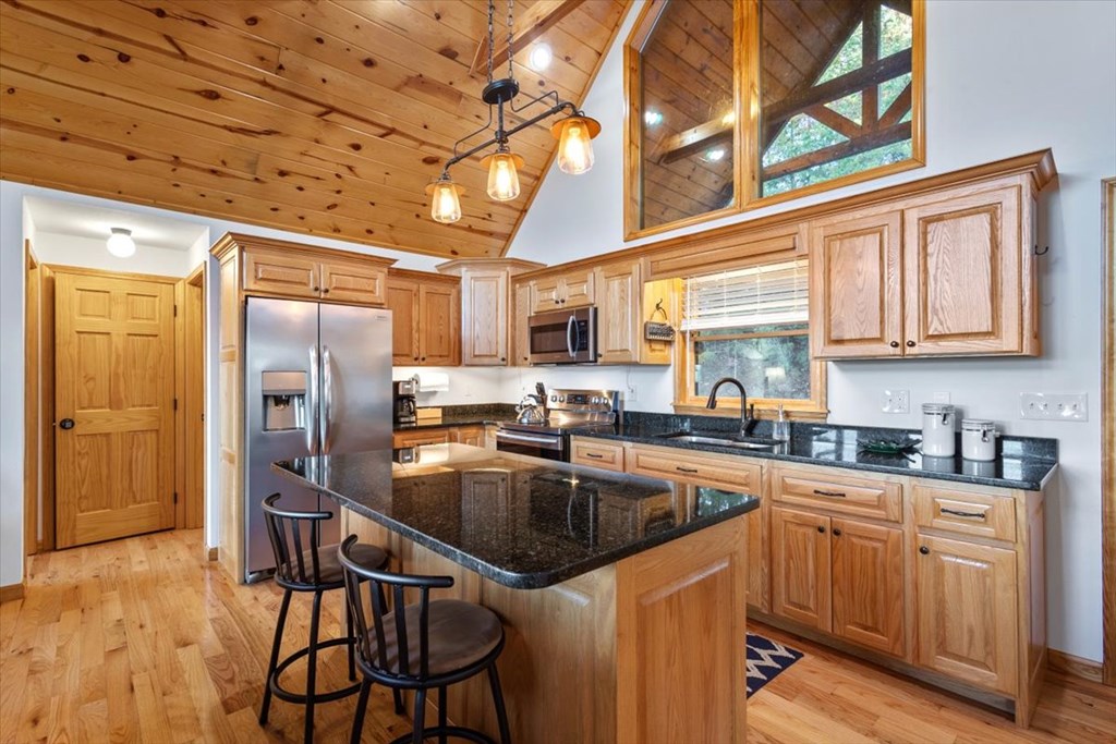 190 Regency Drive Murphy, NC 28906 - Photo 21 of 42 a kitchen with stainless steel appliances granite countertop a sink a stove and refrigerator