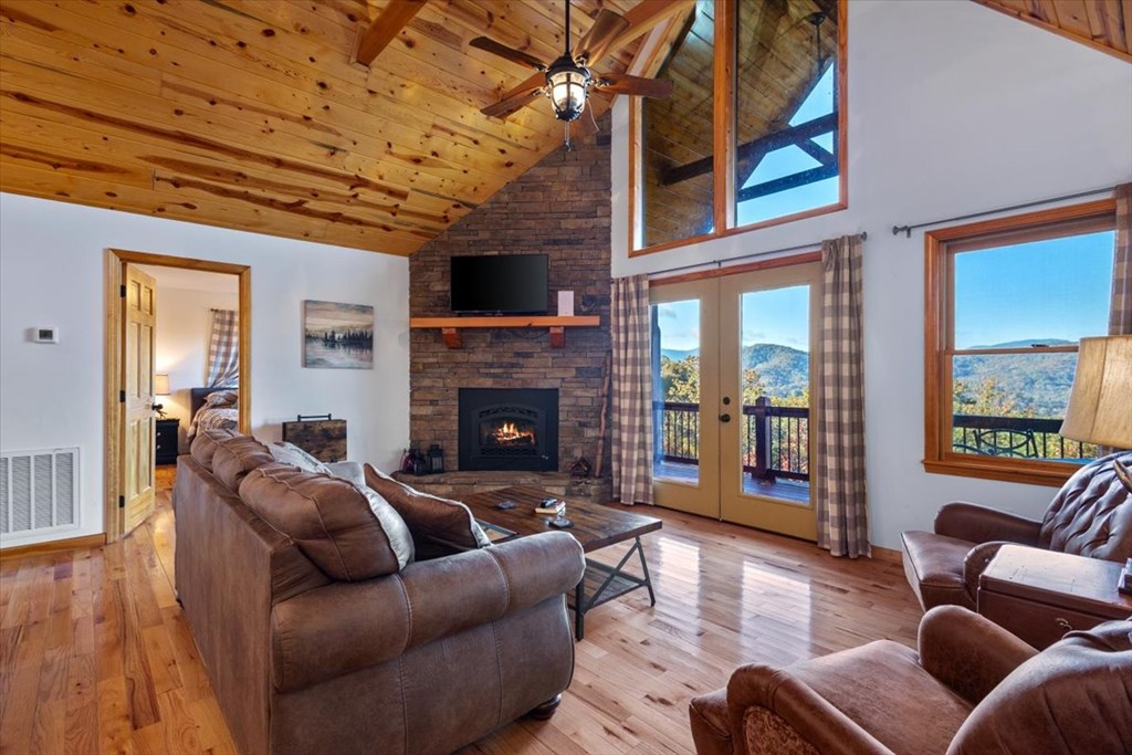 190 Regency Drive Murphy, NC 28906 - Photo 27 of 42 a living room with furniture a flat screen tv and a fireplace