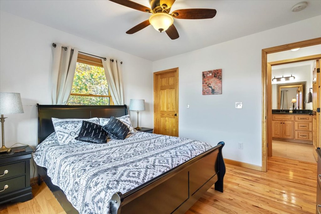 190 Regency Drive Murphy, NC 28906 - Photo 37 of 42 a bedroom with a bed and wooden floor