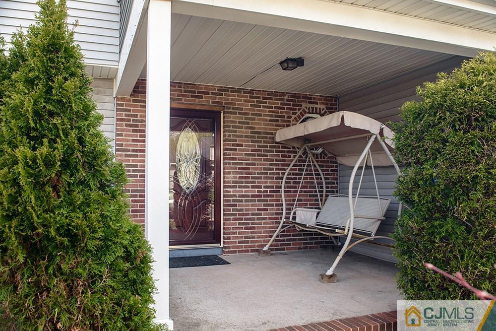 56 Brookside Road Edison, NJ 08817 - Photo 2 of 24 a front view of a house with a garden