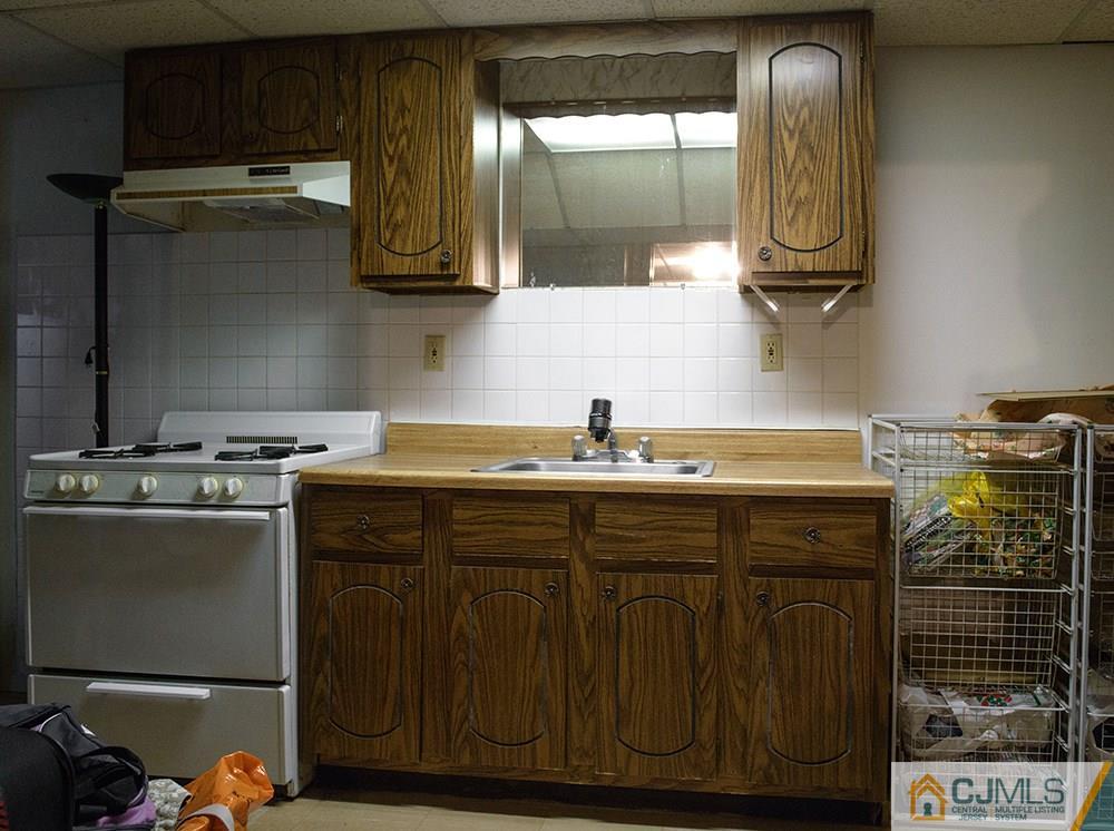 56 Brookside Road Edison, NJ 08817 - Photo 17 of 24 a kitchen with a sink and cabinets