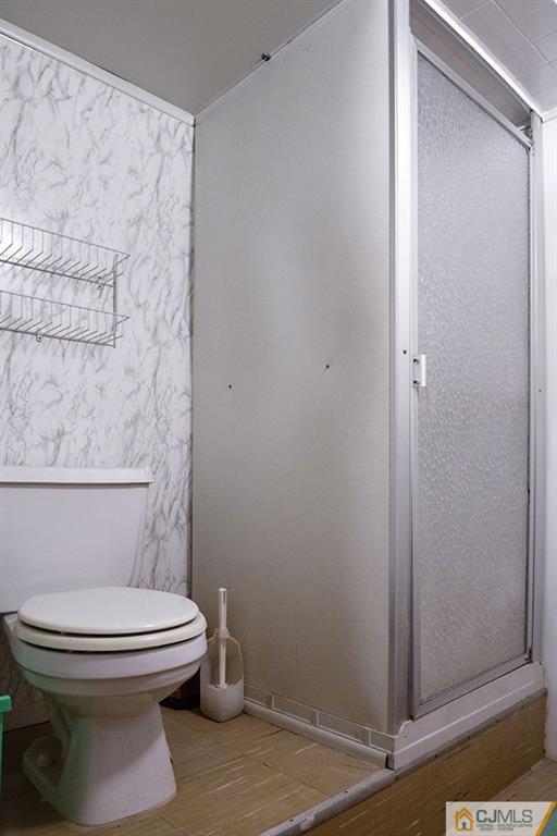 56 Brookside Road Edison, NJ 08817 - Photo 18 of 24 a bathroom with a toilet and a shower