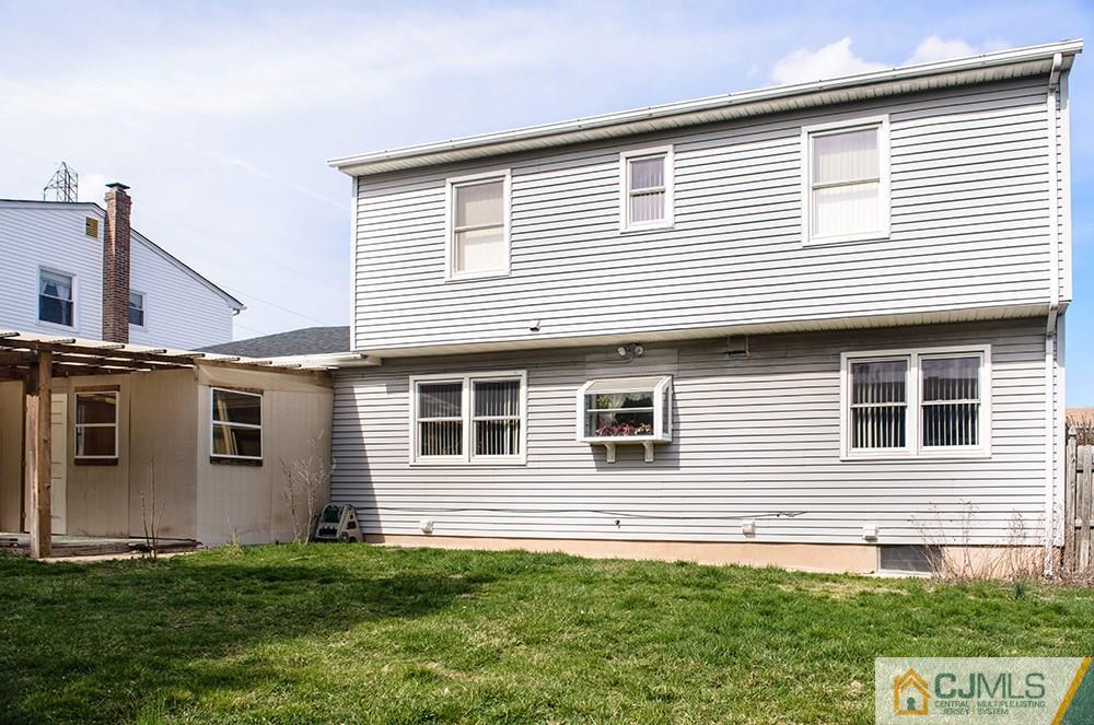 56 Brookside Road Edison, NJ 08817 - Photo 20 of 24 a front view of a house with a yard