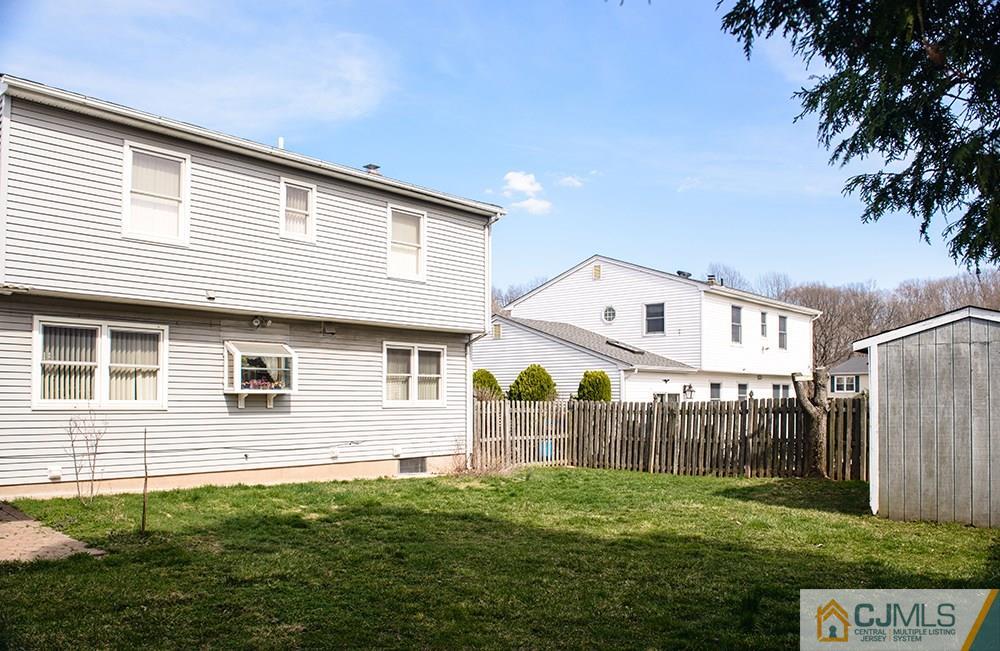 56 Brookside Road Edison, NJ 08817 - Photo 21 of 24 a front view of a house with a yard