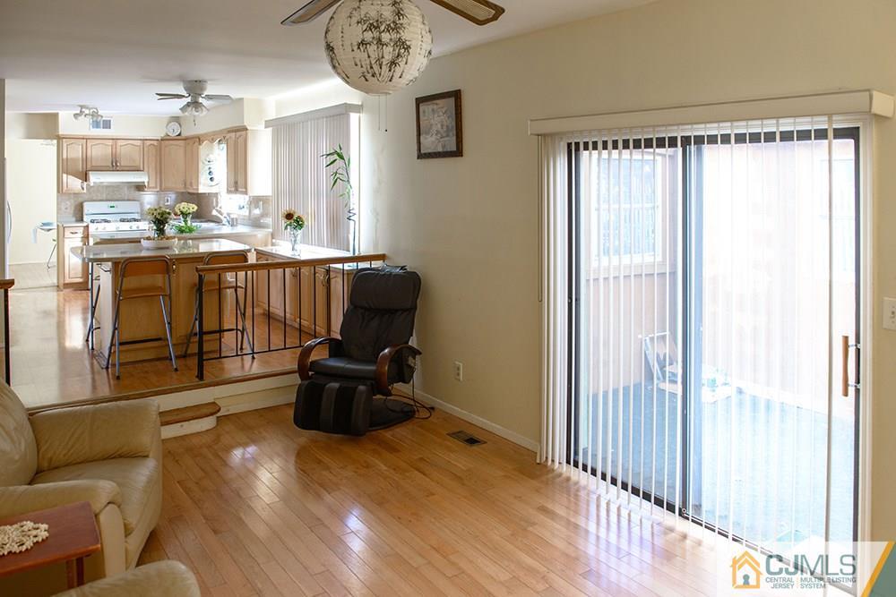 56 Brookside Road Edison, NJ 08817 - Photo 5 of 24 a living room with furniture and a large window
