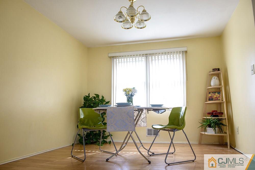 56 Brookside Road Edison, NJ 08817 - Photo 6 of 24 a view of a dining room with furniture and a window