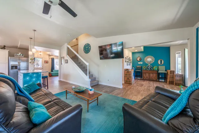 a spacious bathroom with a granite countertop sink mirror and shower
