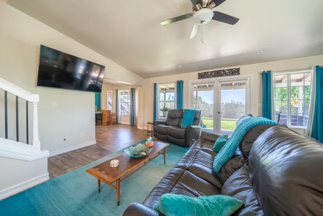 a view of walk in closet with clothes