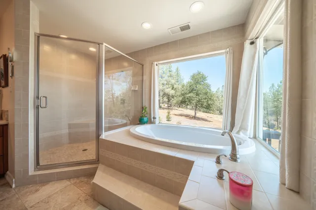 a view of balcony with wooden floor and fence