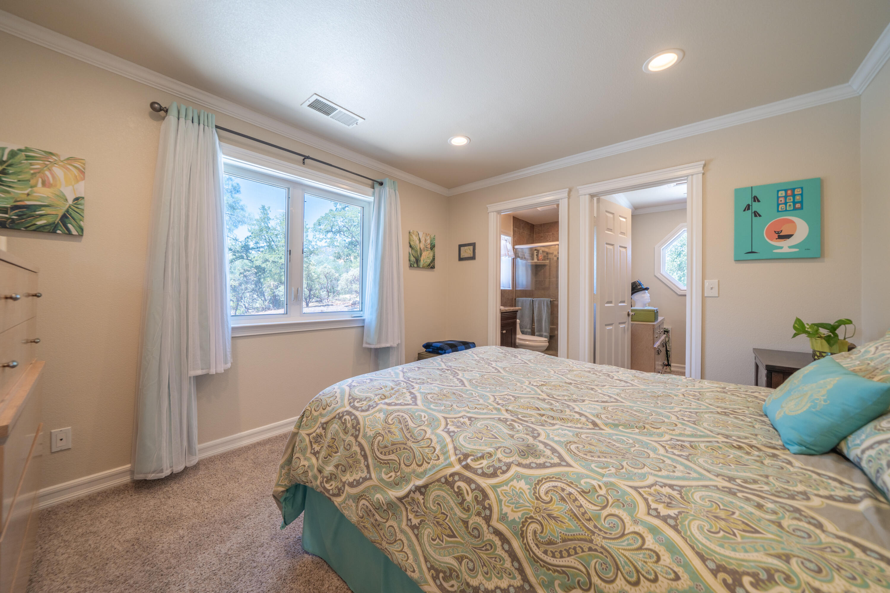 7954 Placer Road Redding, CA 96001 - Photo 20 of 97 a bedroom with a large bed and a window