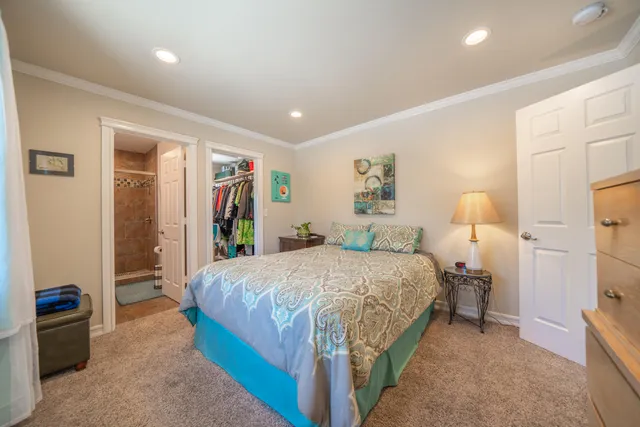 a balcony with wooden floor and outdoor seating