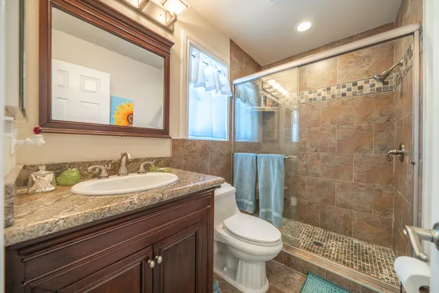 a view of a house with a yard and sitting area