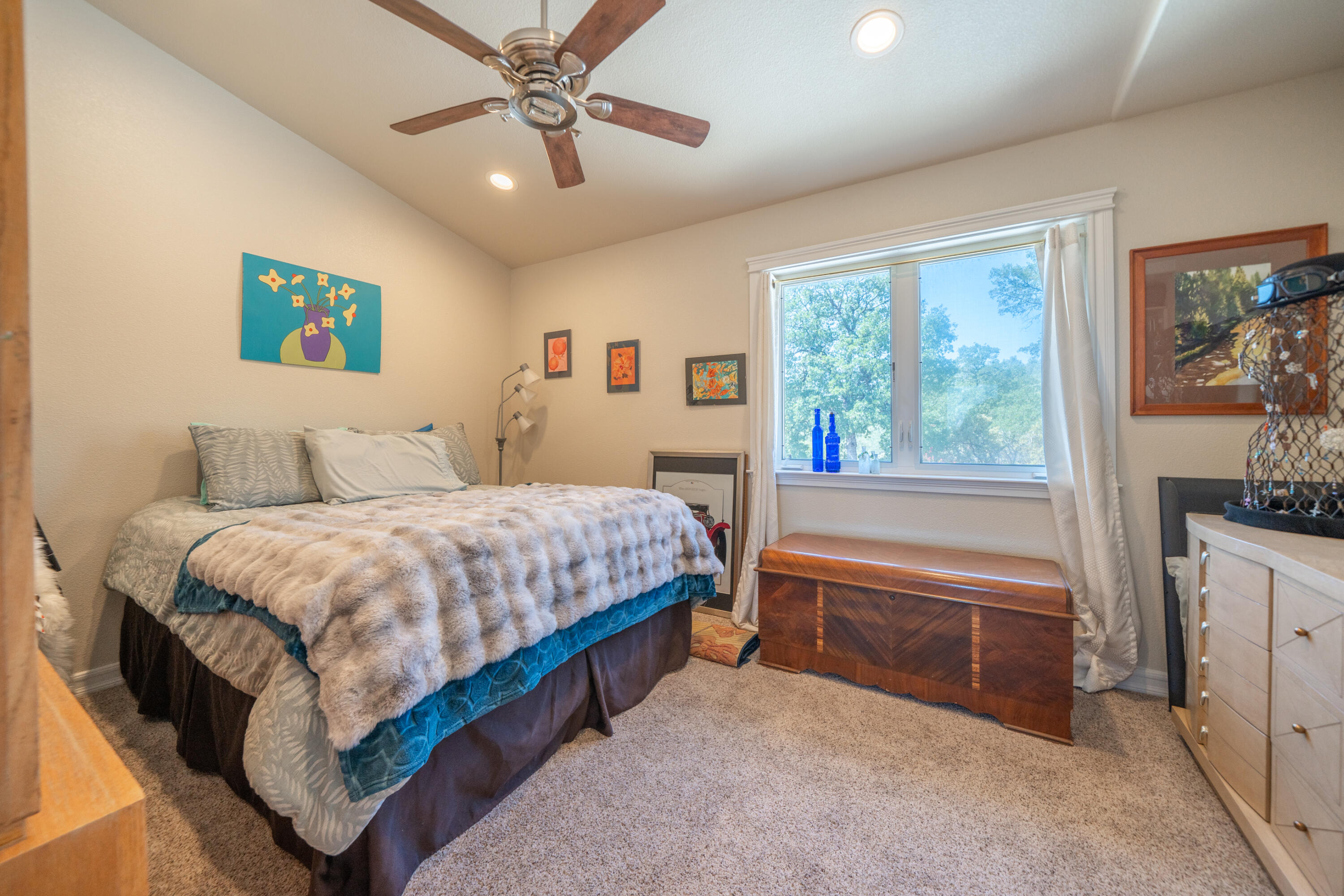 7954 Placer Road Redding, CA 96001 - Photo 25 of 97 a bedroom with a bed and a flat screen tv
