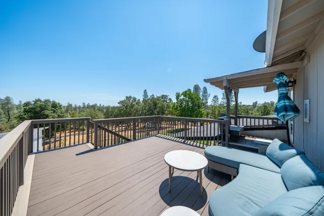 a view of a house with a yard porch and sitting area