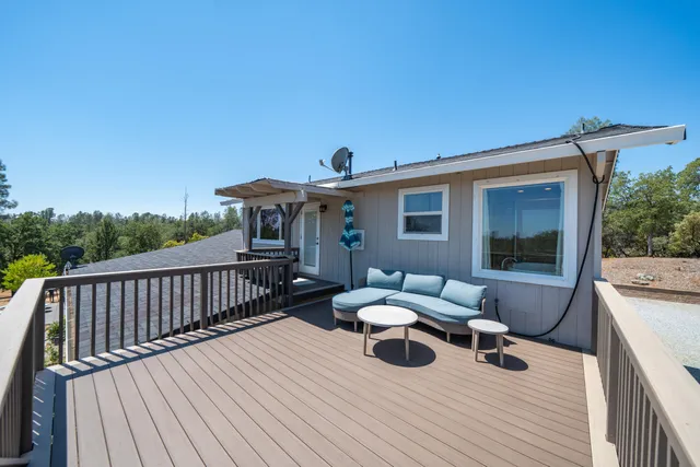 a view of a chair and tables in the patio