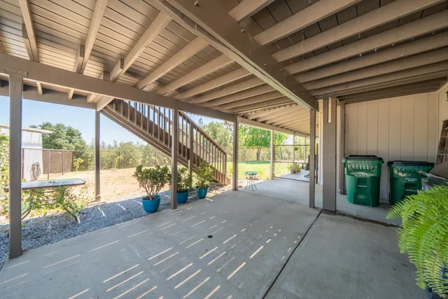 a view of a swimming pool with an outdoor space and seating area