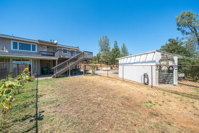 a view of a yard with tree s