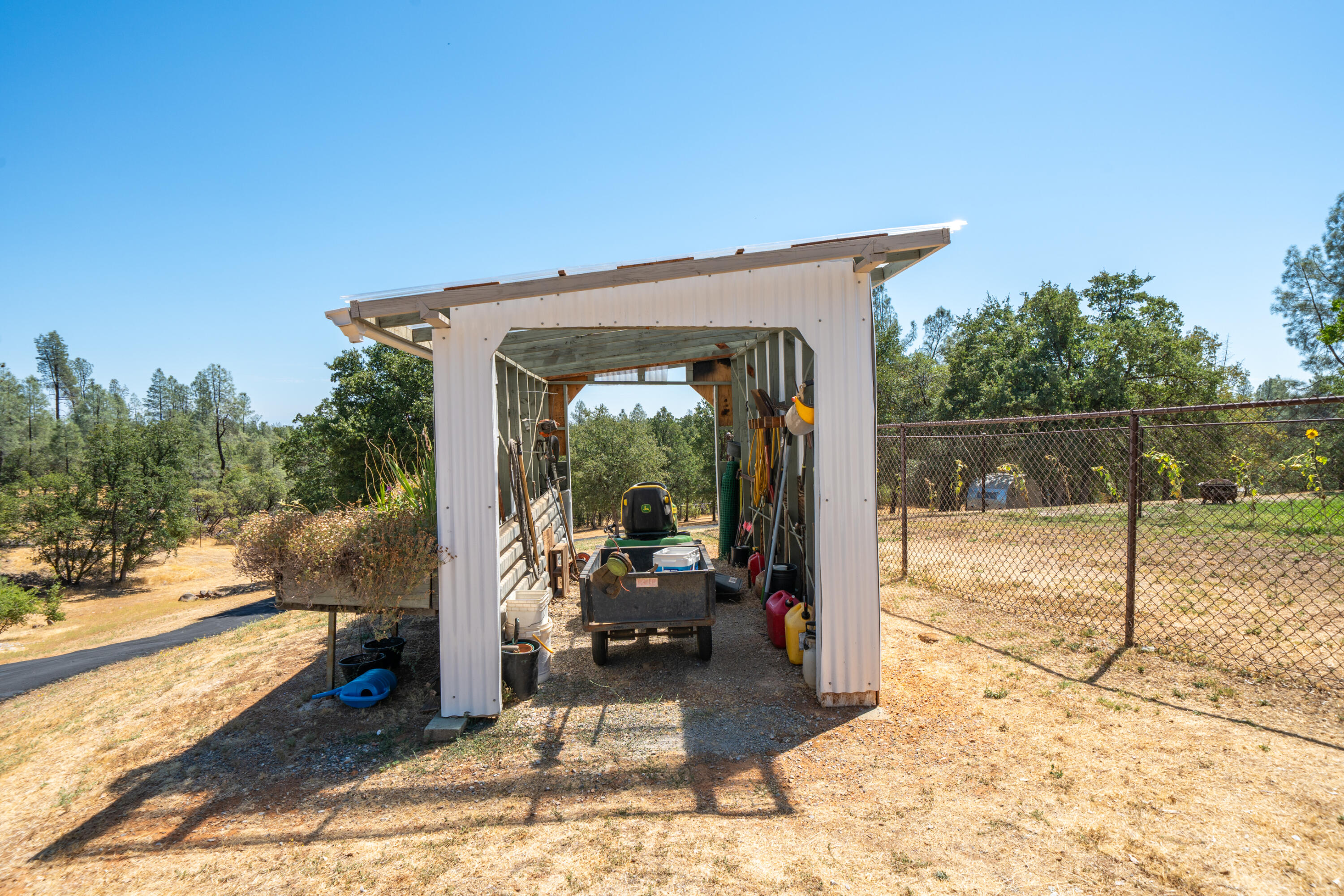 7954 Placer Road Redding, CA 96001 - Photo 56 of 97 a view of a porch with a floor to ceiling window next to a yard