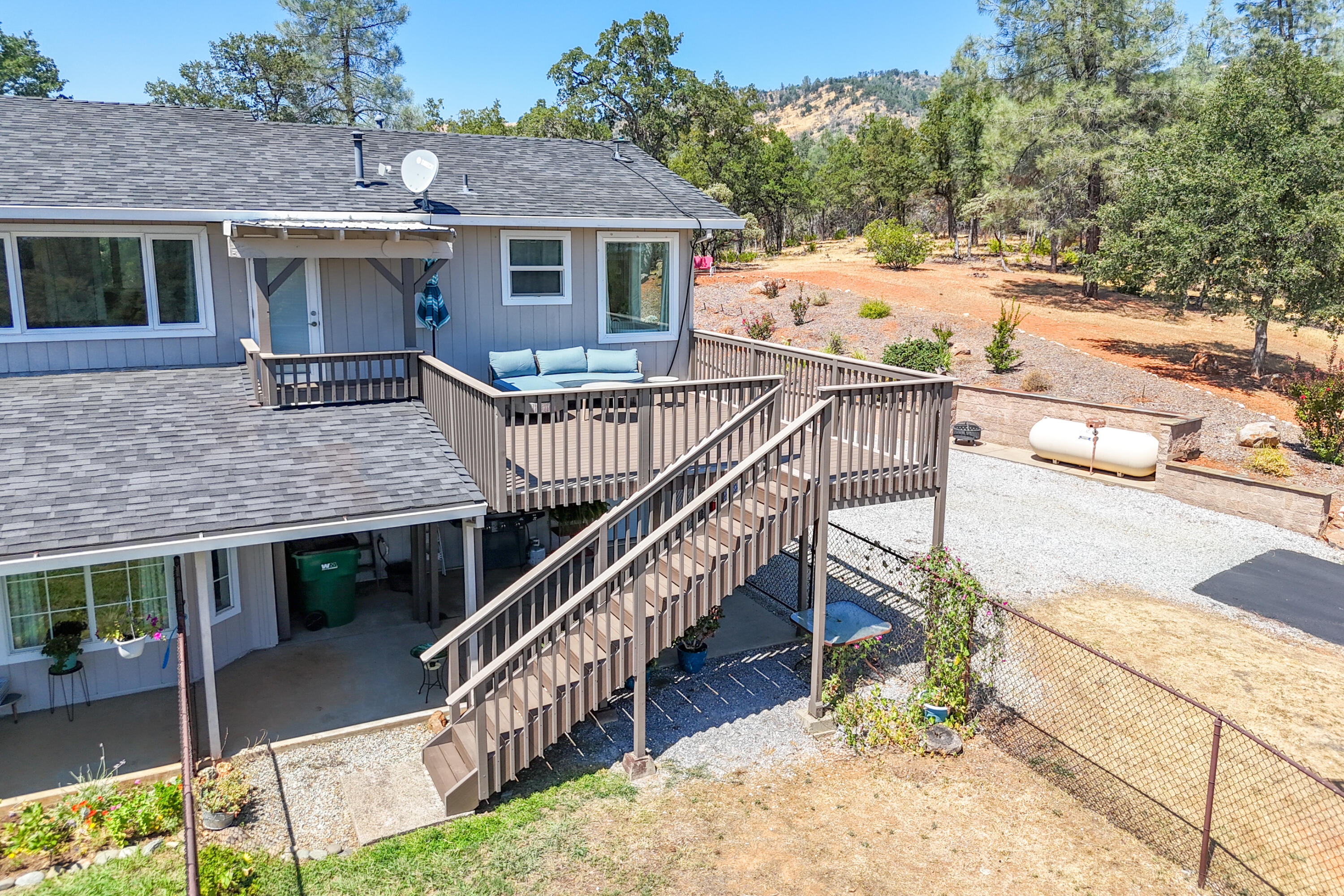 7954 Placer Road Redding, CA 96001 - Photo 91 of 97 a front view of house with yard and trees in the background