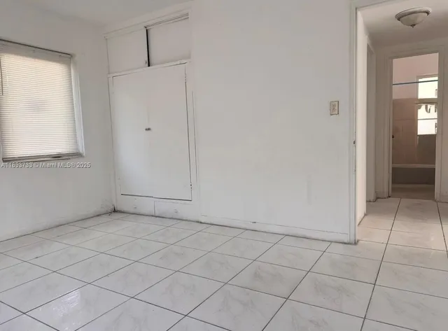 an empty room with cabinet