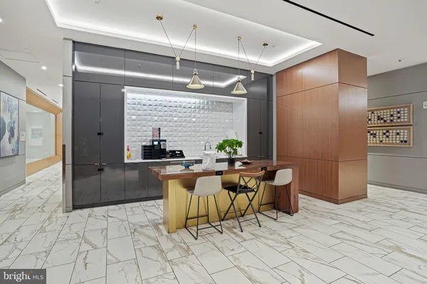 a kitchen with a table and chairs in it