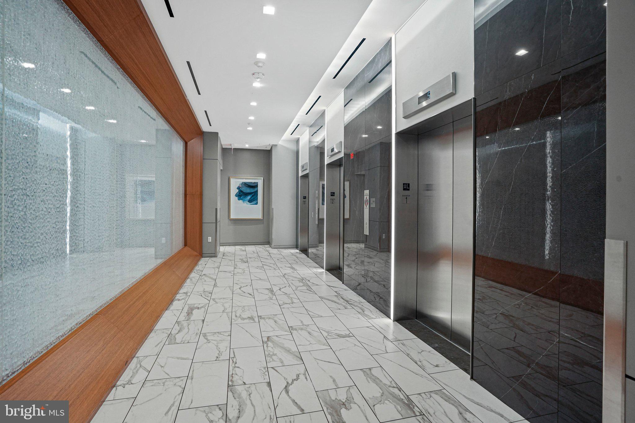 1211 Van Street Southeast, Unit 614 Washington, DC 20003 - Photo 19 of 21 a bathroom with a glass door shower